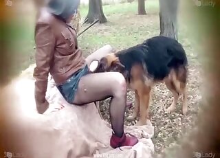 An excellent woman is deepthroating a dog cock