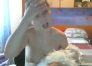 Cute zoophile lets dog suck on her tits and such
