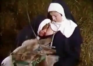 Nun-looking chick about to enjoy bestiality